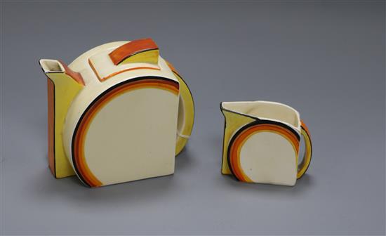 A Clarice Cliff Bizarre teapot and a matching cream jug